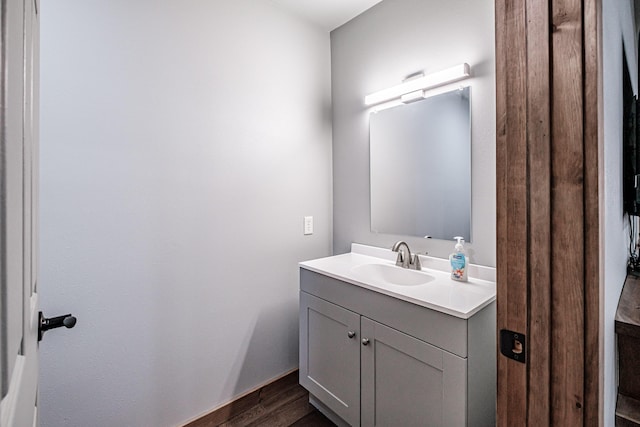bathroom featuring wood finished floors and vanity