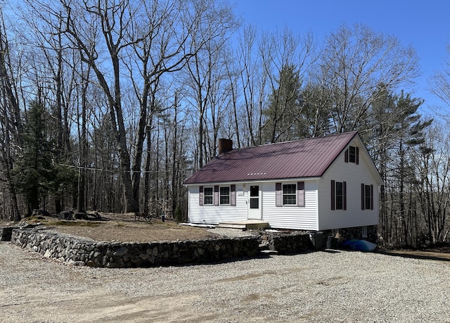 2586 Acton Ridge Rd, Newfield, ME 04095 - view of front facade with metal roof and a chimney