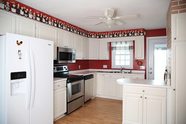 165 Pleasant Ave, Madawaska, ME 04756 - kitchen featuring appliances with stainless steel finishes, a ceiling fan, and white cabinetry