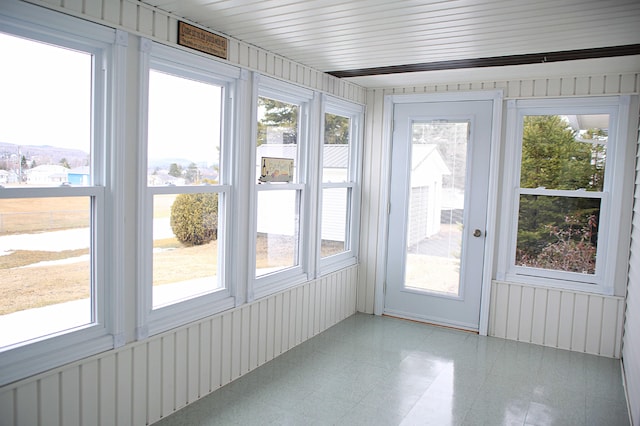 165 Pleasant Ave, Madawaska, ME 04756 - unfurnished sunroom with healthy amount of natural light and tile patterned floors