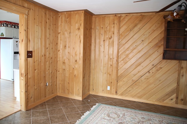 165 Pleasant Ave, Madawaska, ME 04756 - spare room featuring dark tile patterned floors, wooden walls, and baseboards