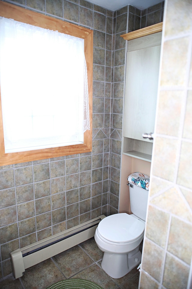 165 Pleasant Ave, Madawaska, ME 04756 - bathroom with baseboard heating, toilet, and tile patterned floors