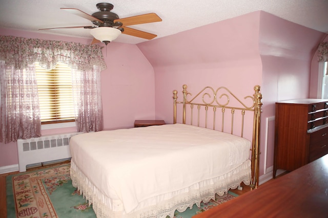 165 Pleasant Ave, Madawaska, ME 04756 - bedroom with radiator heating unit, a ceiling fan, and lofted ceiling