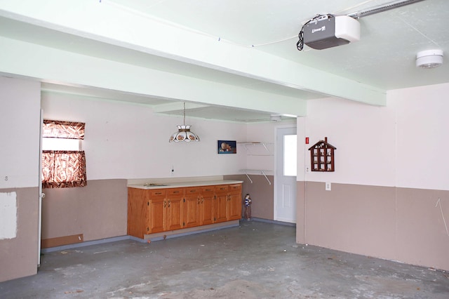 165 Pleasant Ave, Madawaska, ME 04756 - garage featuring a garage door opener