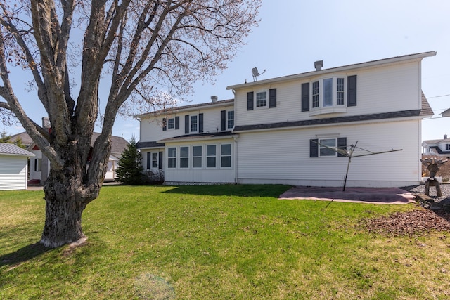 165 Pleasant Ave, Madawaska, ME 04756 - back of house featuring a patio area and a lawn