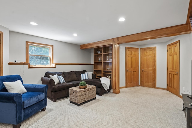 living room featuring recessed lighting, baseboards, and carpet floors