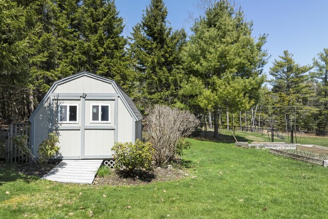 view of shed with fence
