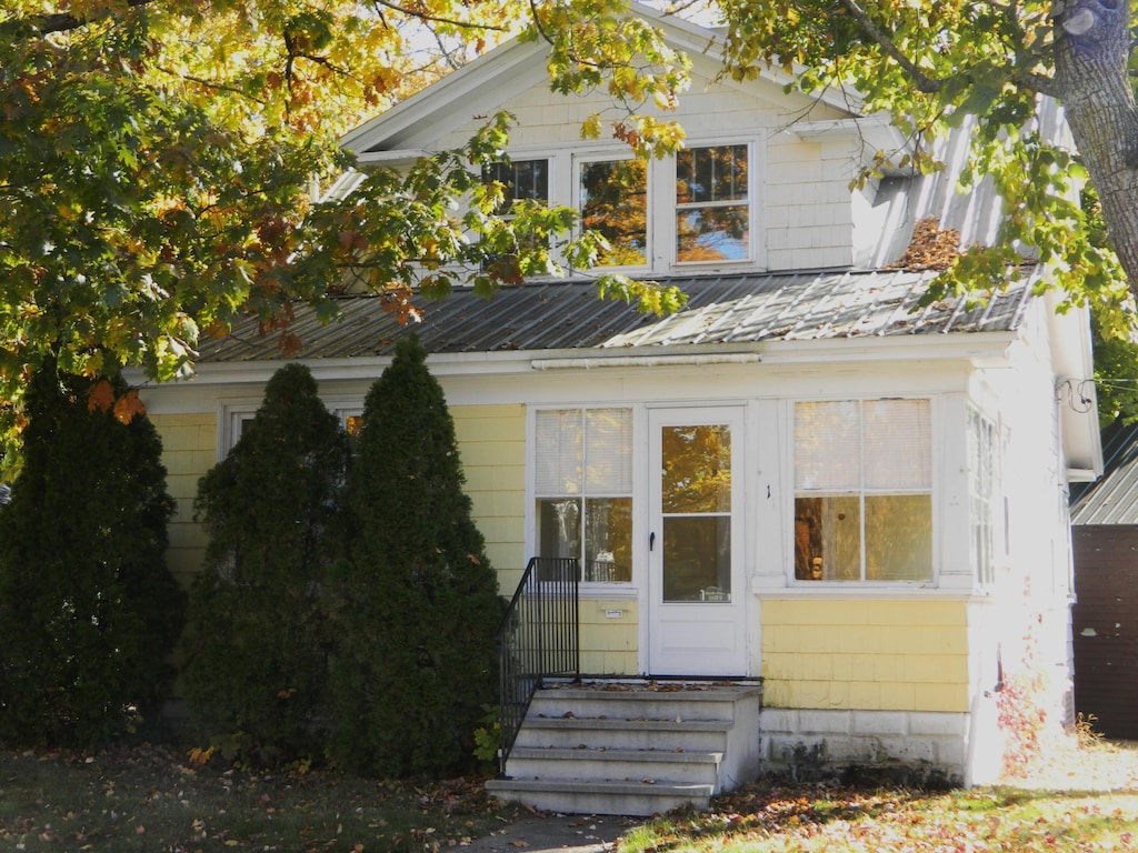 1 Prospect St, Sanford, ME 04083 - view of front facade featuring entry steps and metal roof