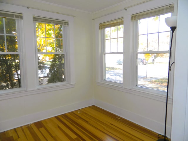1 Prospect St, Sanford, ME 04083 - empty room with ornamental molding, baseboards, and wood finished floors