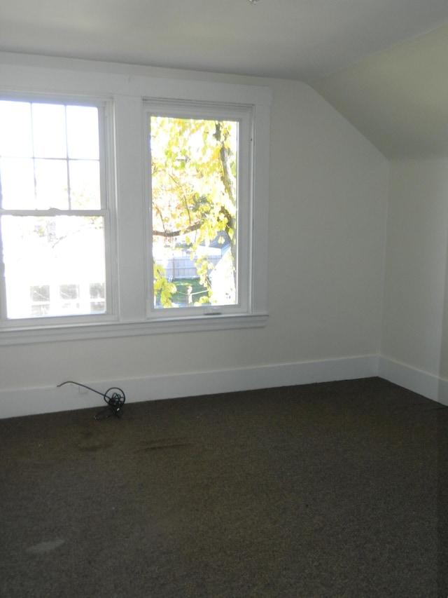 1 Prospect St, Sanford, ME 04083 - bonus room with baseboards, vaulted ceiling, and carpet floors
