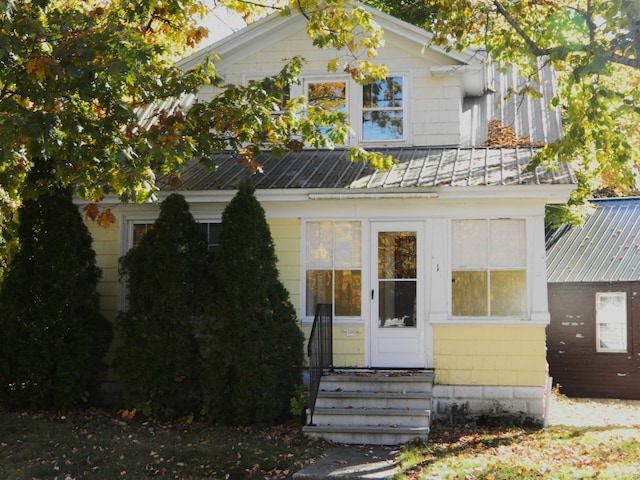 1 Prospect St, Sanford, ME 04083 - view of front of home featuring a standing seam roof, metal roof, and entry steps