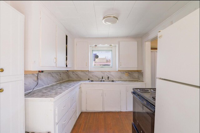 21 Exeter Rd, Corinna, ME 04928 - kitchen with a sink, electric range, light countertops, and freestanding refrigerator