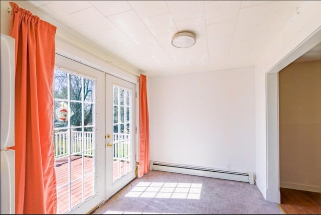21 Exeter Rd, Corinna, ME 04928 - doorway to outside featuring baseboard heating, carpet floors, and french doors
