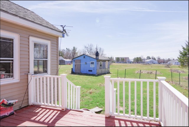 21 Exeter Rd, Corinna, ME 04928 - deck featuring an outdoor structure and a lawn