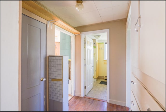 21 Exeter Rd, Corinna, ME 04928 - hall featuring wood finished floors and baseboards