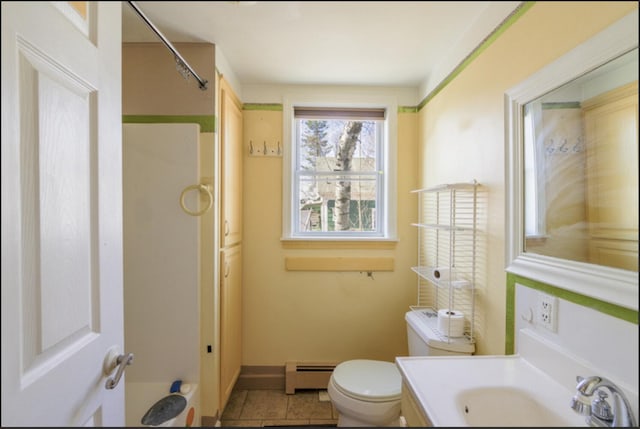 21 Exeter Rd, Corinna, ME 04928 - full bath featuring vanity, tile patterned floors, toilet, baseboards, and a baseboard radiator