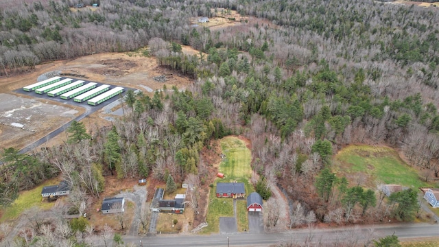 birds eye view of property with a forest view