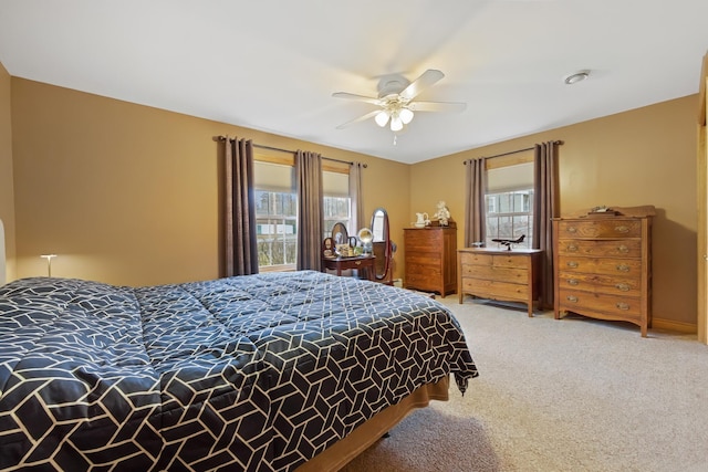bedroom with light colored carpet and ceiling fan