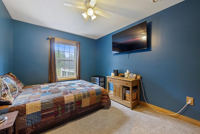 bedroom with baseboards, ceiling fan, and carpet