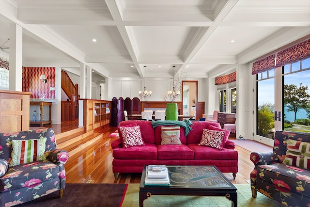 living room featuring beamed ceiling, wood finished floors, an inviting chandelier, and coffered ceiling
