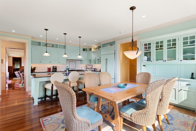 dining room with wood finished floors and recessed lighting