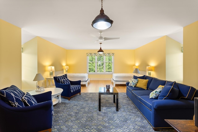 living area featuring wood finished floors and ceiling fan