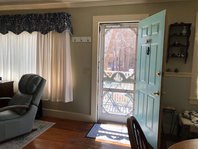 57 Salmond St, Belfast, ME 04915 - entryway with dark wood-style floors, baseboards, and ornamental molding