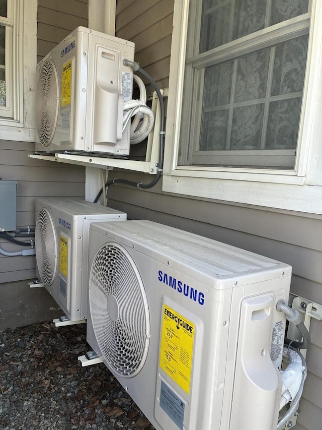 57 Salmond St, Belfast, ME 04915 - laundry area featuring independent washer and dryer, ac unit, wooden walls, and cabinet space