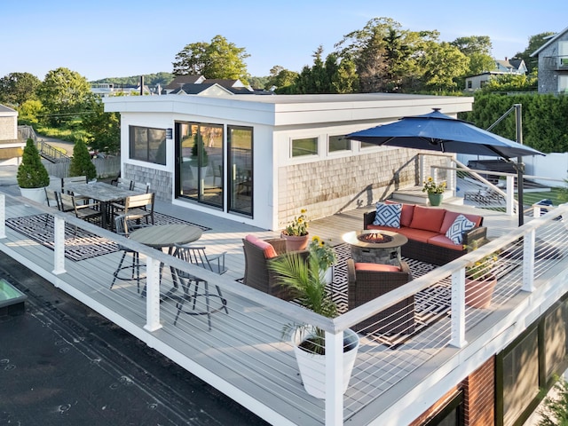 21 Atlantic St, Rockland, ME 04841 - wooden deck with an outdoor living space with a fire pit and outdoor dining space
