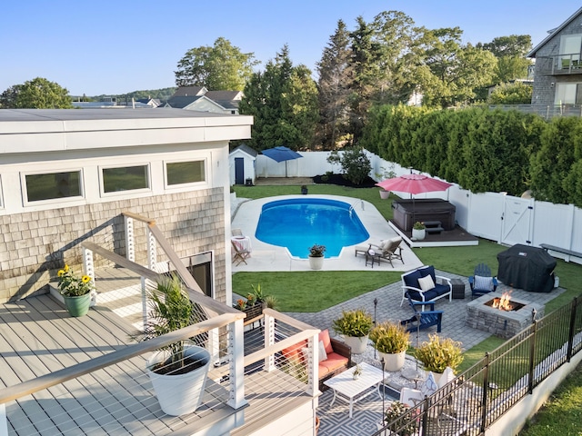 21 Atlantic St, Rockland, ME 04841 - view of swimming pool featuring a fenced backyard, an outdoor living space with a fire pit, a patio area, and a wooden deck
