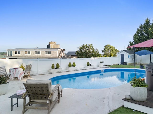 21 Atlantic St, Rockland, ME 04841 - view of pool featuring a storage shed, a fenced backyard, and a patio area