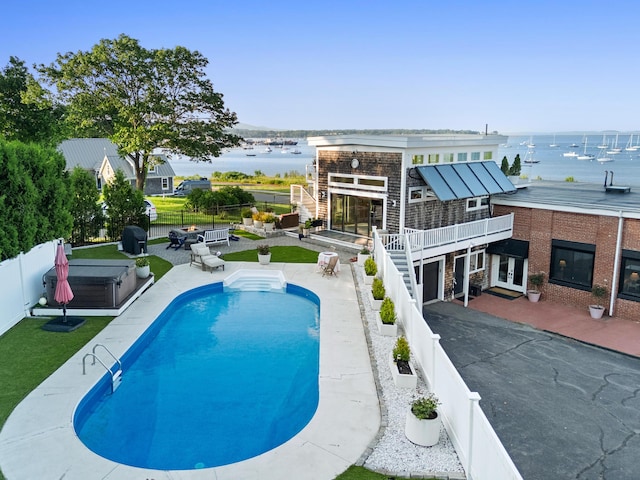 21 Atlantic St, Rockland, ME 04841 - view of pool with a fenced backyard, a hot tub, a patio, stairs, and a deck with water view