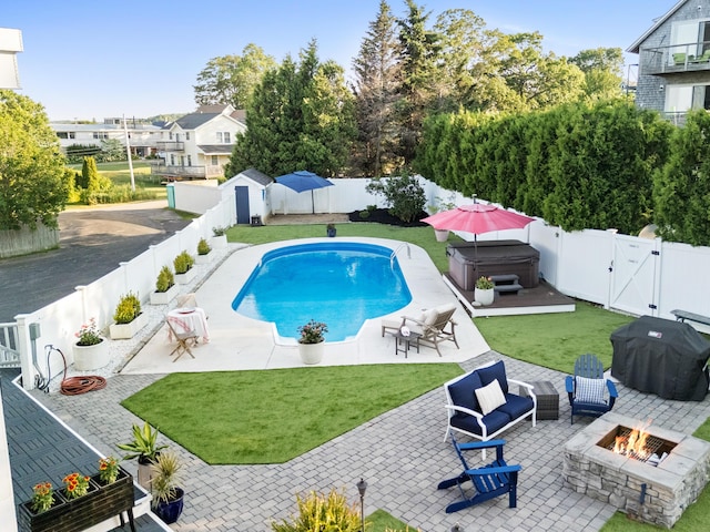 21 Atlantic St, Rockland, ME 04841 - view of swimming pool with an outdoor fire pit, a hot tub, a patio area, a fenced backyard, and a gate