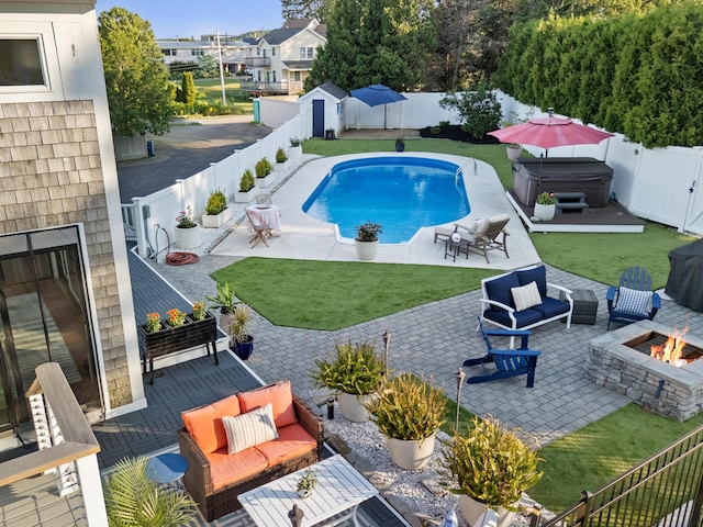21 Atlantic St, Rockland, ME 04841 - view of swimming pool featuring an outdoor living space with a fire pit, a fenced backyard, and a patio
