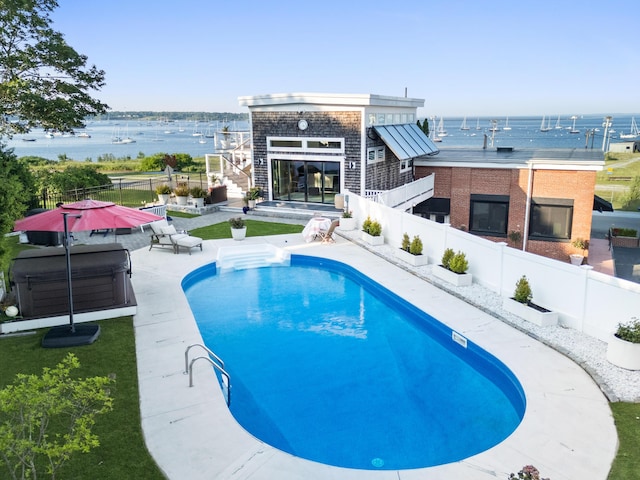 21 Atlantic St, Rockland, ME 04841 - view of swimming pool with a hot tub, a fenced backyard, a water view, and a patio