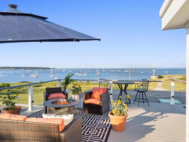 21 Atlantic St, Rockland, ME 04841 - wooden terrace with a fire pit and a water view