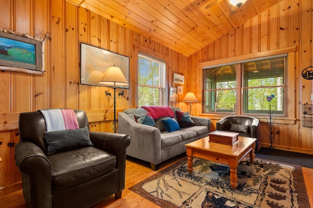 747 S Shore Dr Unit 6, Rangeley Plt, ME 04970 - living area with vaulted ceiling, wooden walls, wood finished floors, and wooden ceiling