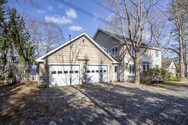 view of front of house with an attached garage and driveway