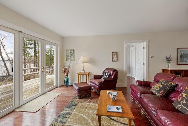living area with baseboards and wood-type flooring