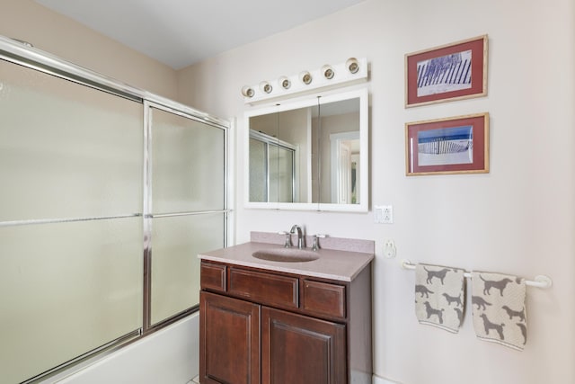 full bathroom featuring vanity and enclosed tub / shower combo