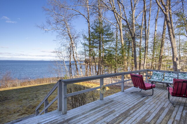 deck featuring a water view