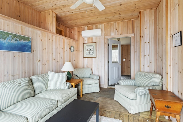 living area with a wall mounted air conditioner, wood walls, a ceiling fan, and wood finished floors