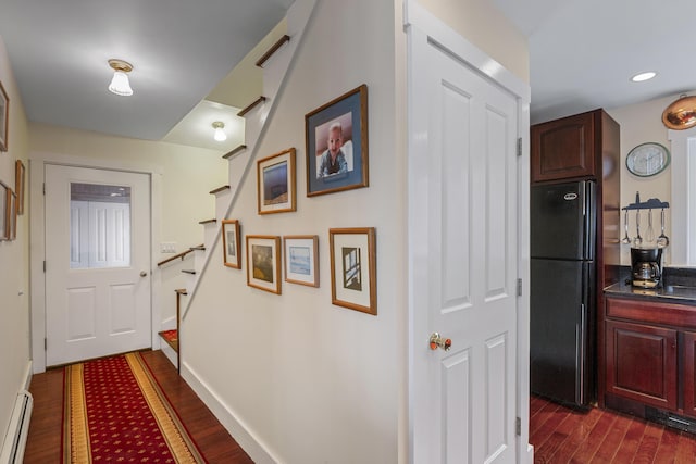 entryway with recessed lighting, baseboard heating, baseboards, stairs, and dark wood-style flooring