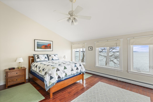 bedroom with wood-type flooring, vaulted ceiling, baseboard heating, and ceiling fan