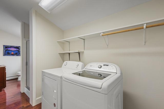 clothes washing area with a baseboard radiator, washer and dryer, and dark wood-style floors