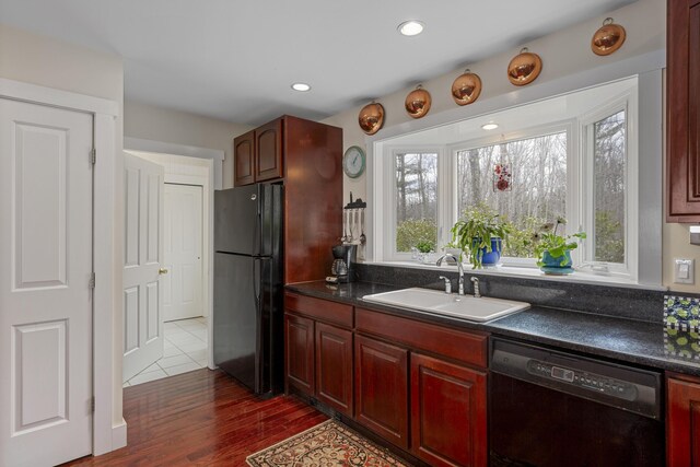 33 Crest St, Northport, ME 04849 - kitchen with black appliances, dark countertops, dark brown cabinets, and recessed lighting