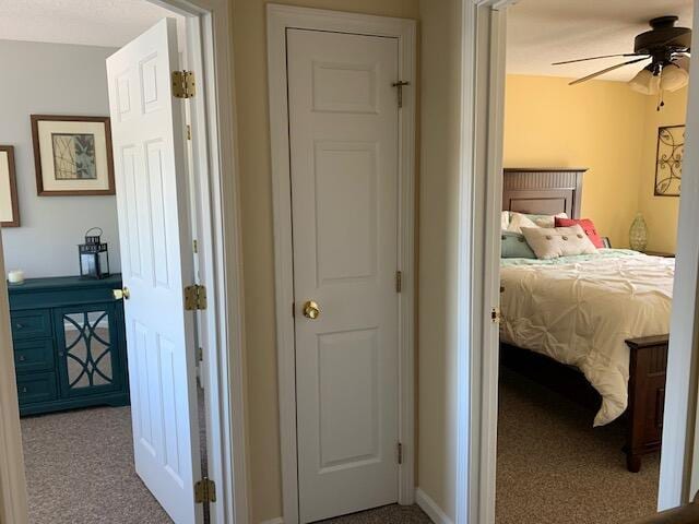 carpeted bedroom with baseboards