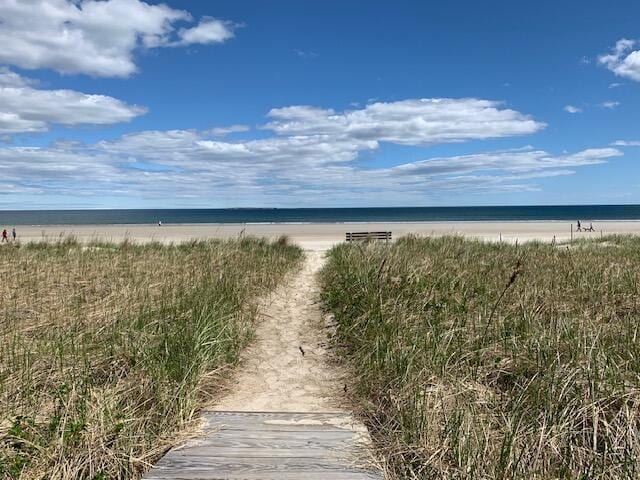 property view of water featuring a beach view