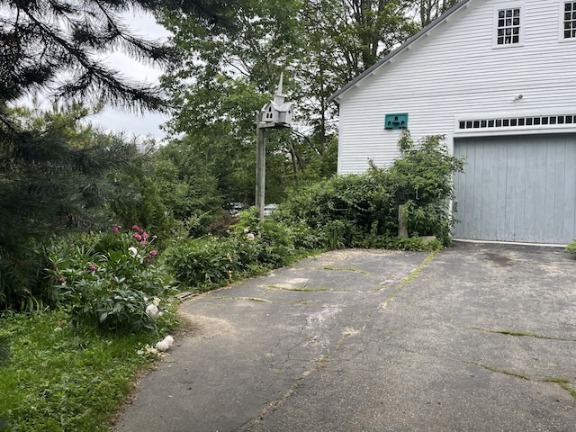 67 Elm St, Newfield, ME 04095 - view of side of home featuring a garage