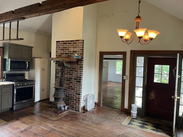67 Elm St, Newfield, ME 04095 - foyer featuring hardwood / wood-style floors, a wood stove, a chandelier, and high vaulted ceiling
